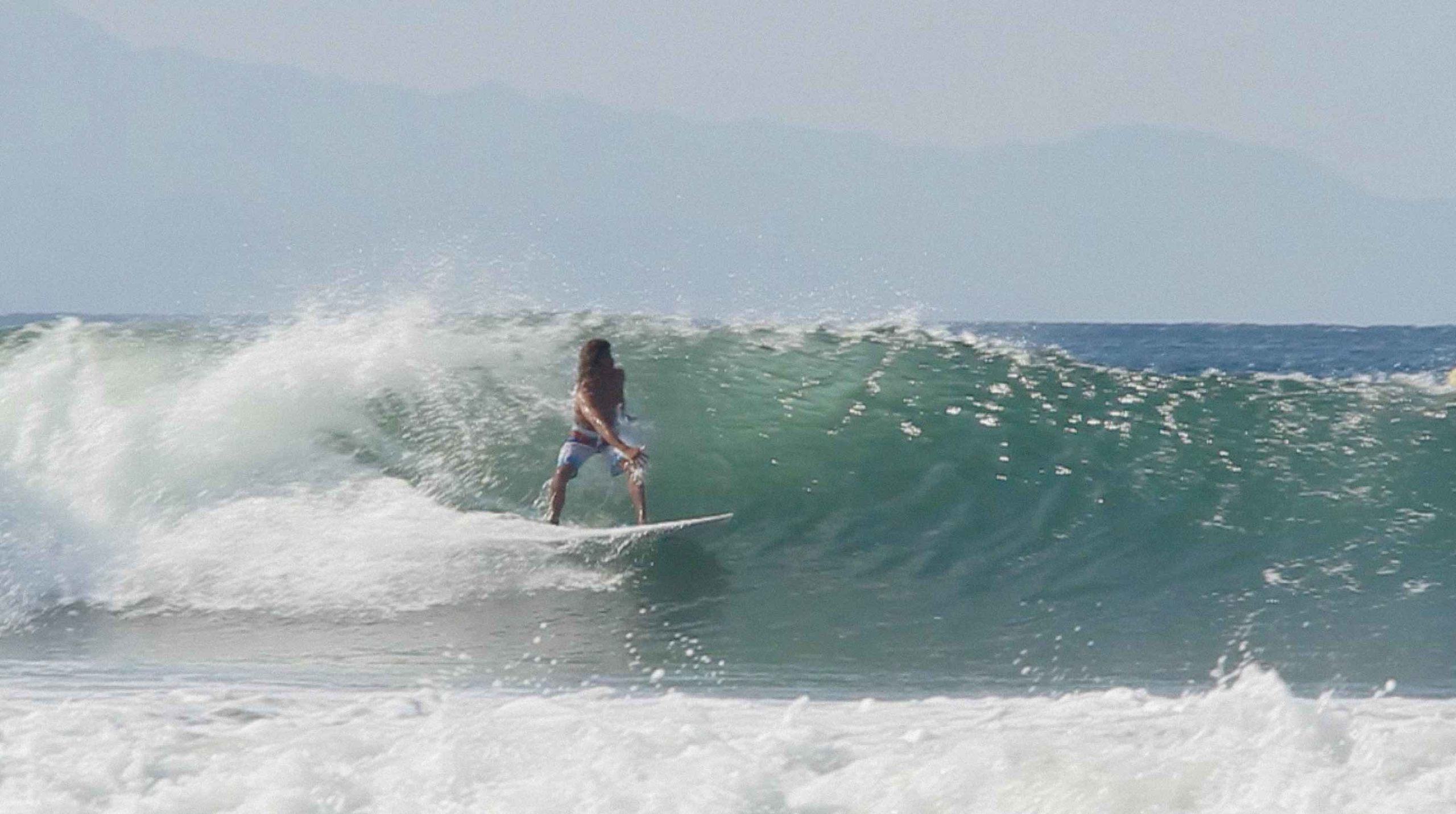 surfer doing a Bottom turn